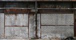 realistic wallpaper of cinder block wall and rusty metal sheets