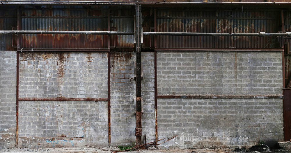 realistic wallpaper of cinder block wall and rusty metal sheets