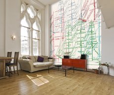 wallpaper in a living room showing masts of sailing ships