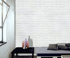papier peint panoramique dans un séjour représentant des briques blanches