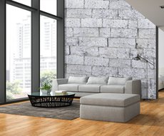 papier peint panoramique représentant un mur de pierres blanches dans un salon