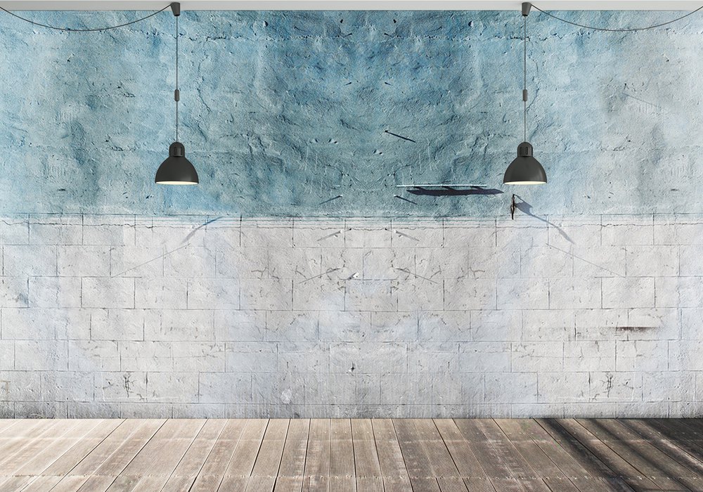 papier peint panoramique représentant un mur de béton bleu et des pierres blanches dans salle
