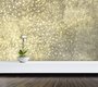 papier peint panoramique dans une pièce représentant une pluie d'étoiles dorées et blanches