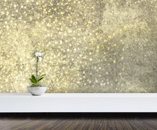 papier peint panoramique dans une pièce représentant une pluie d'étoiles dorées et blanches