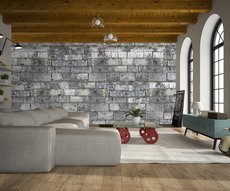 wallpaper showing a grey stone wall in a living room