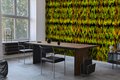 green and yellow striped wallpaper in a dining room